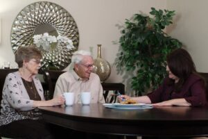 Evergreen Senior Living | Residents speaking with associate