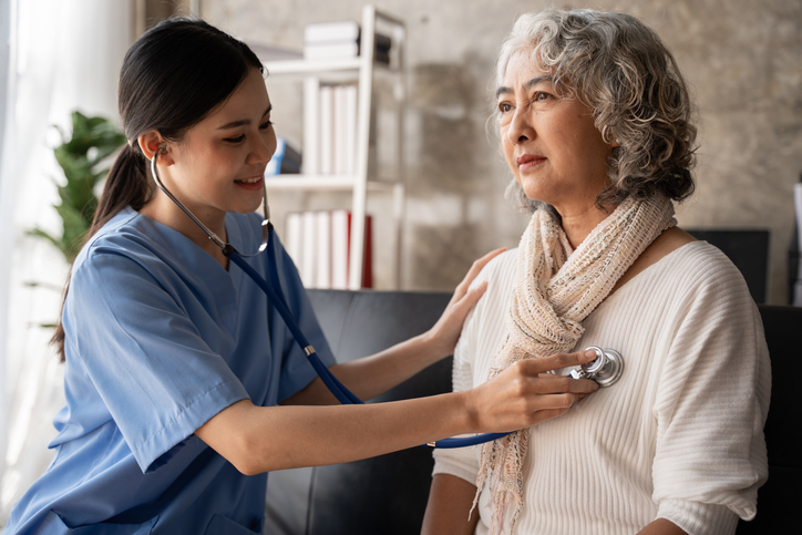 Young nurse and senior woman