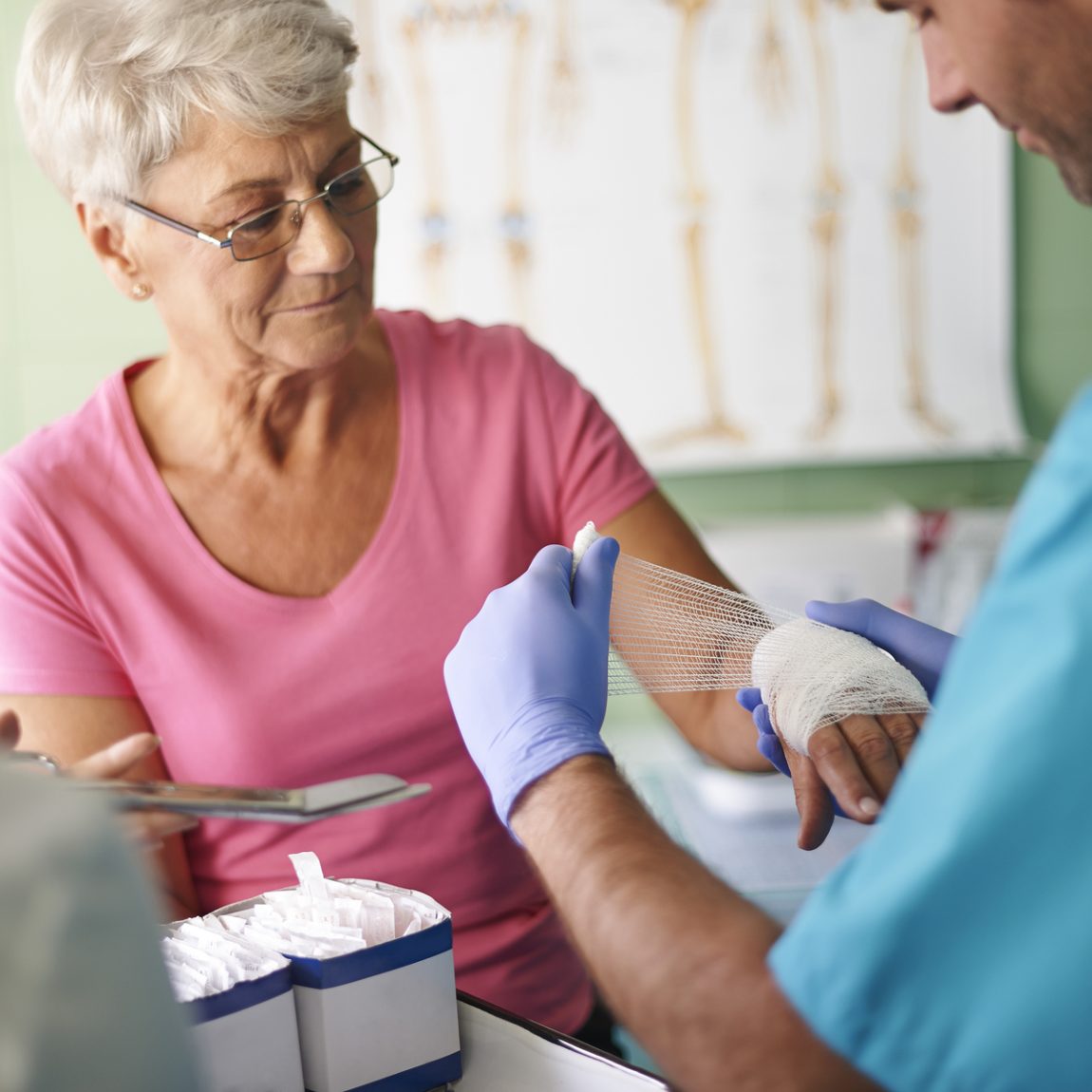 Senior woman with bandage on the hand